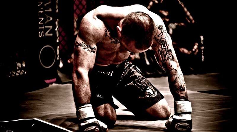 Boxer on his knees trying to get up