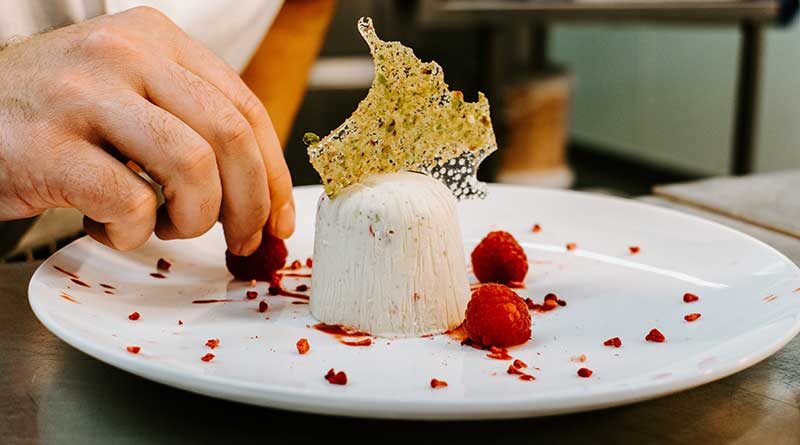 Chef decorating a dessert