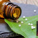 Homeopathic globules on a leaf with Christian Hahnemann in inset