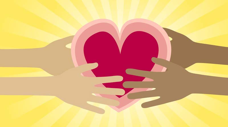 Compassionate hands holding heart