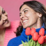 Mother and daughter smiling at each other