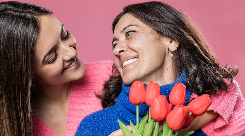 Mother and daughter smiling at each other