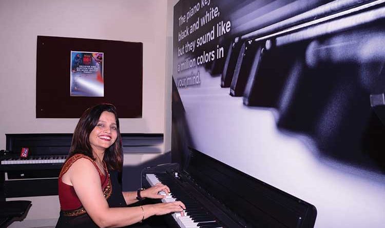 Dharini Upadhyay, co-founder & co-CEO of Furtados School of Music at a piano
