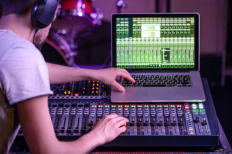 Digital mixer recording studio with computer recording the music.