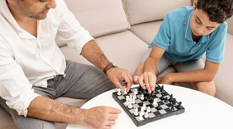 Father and son playing chess