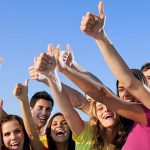 Group of friends giving thumbs up
