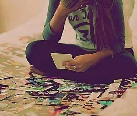 Girl looking at old photos