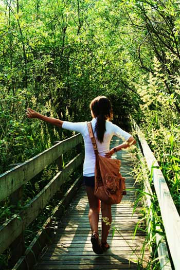 Girl walking through the forest