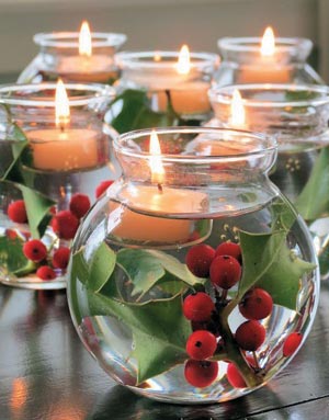 Glass fishbowl with candle and mistletoe
