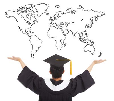 Graduate student looking at the world map