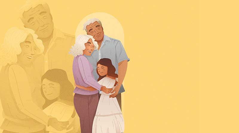 Grandparents hugging granddaughter