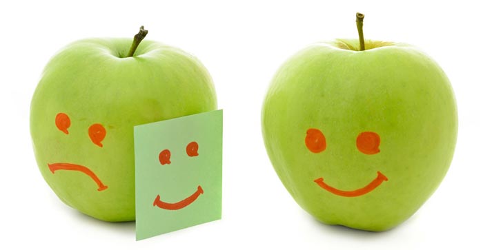 Green apples smiling, crying and looking envious