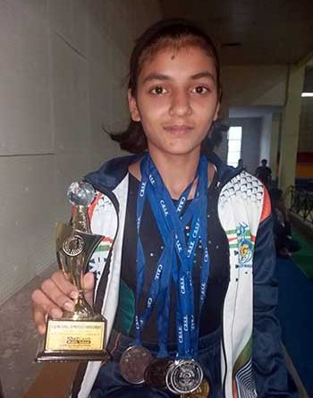 Komal Dhake of Holy Angels' School, Dombivli, with her medals and trophy