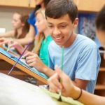 A male and female student during high school art class