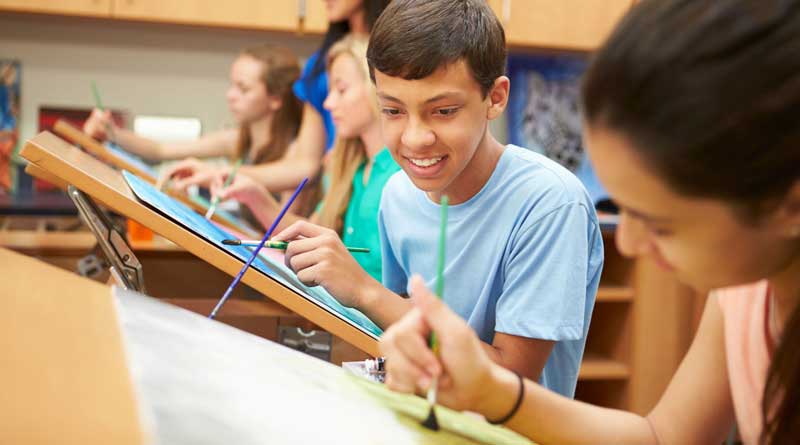 A male and female student during high school art class