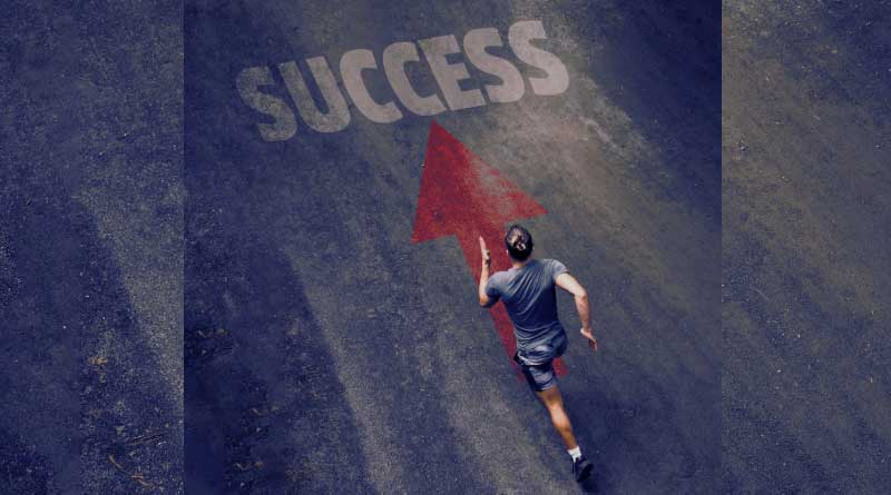 Man running on arrow towards the word success