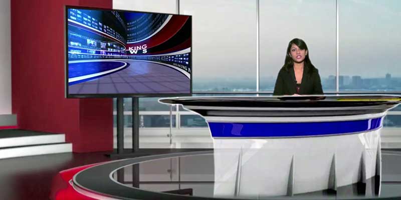 Female news anchor reading the news