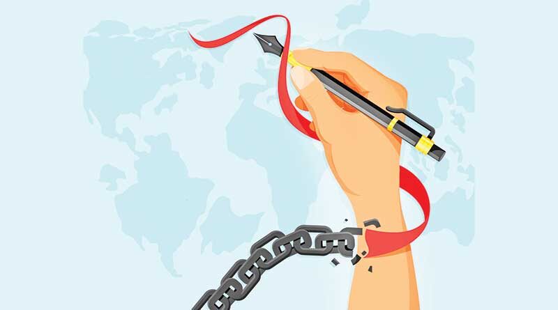 Unchained hand holding a pen