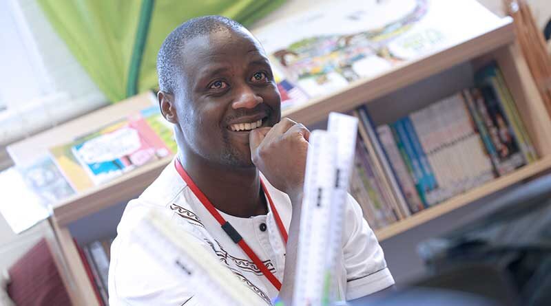 Peter Tabichi in a classroom