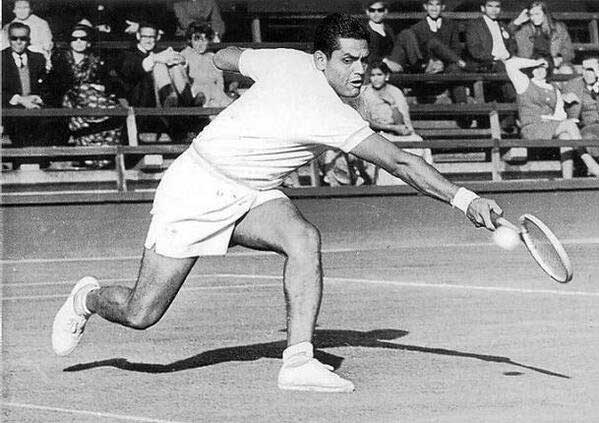 Ramanathan Krishnan plays a backhand shot during a tennis match