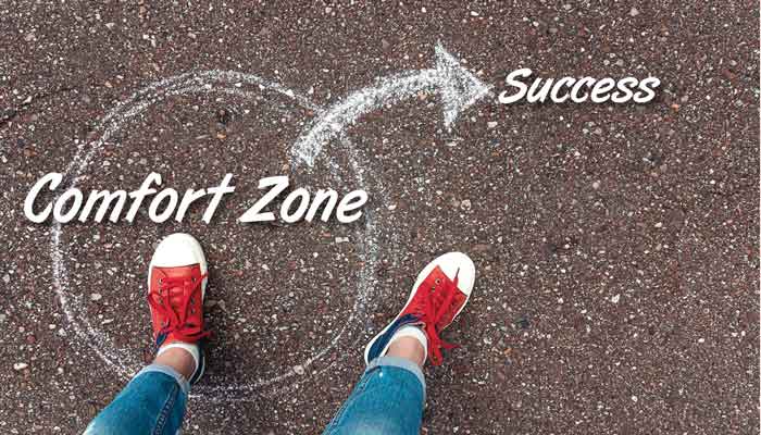 Person with red sneakers standing inside comfort zone