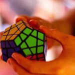 Hands solving Rubik's Cube