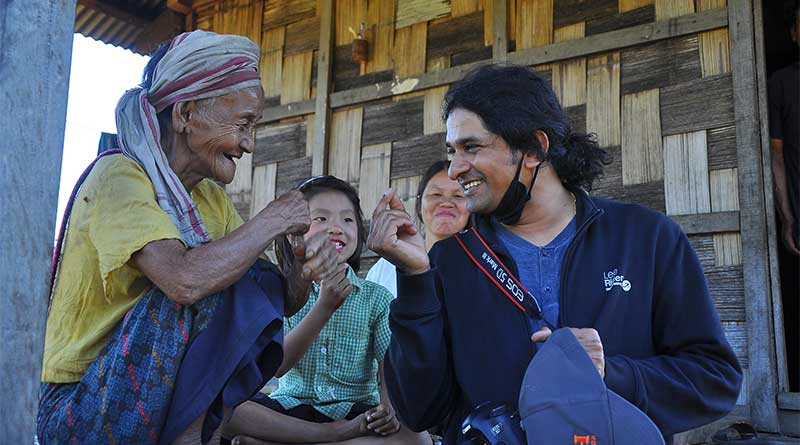 Dr Shaison P. Ouseph with a tribal woman