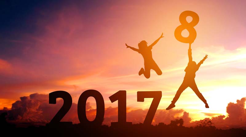 Silhouettes of two people happy for new year 2018