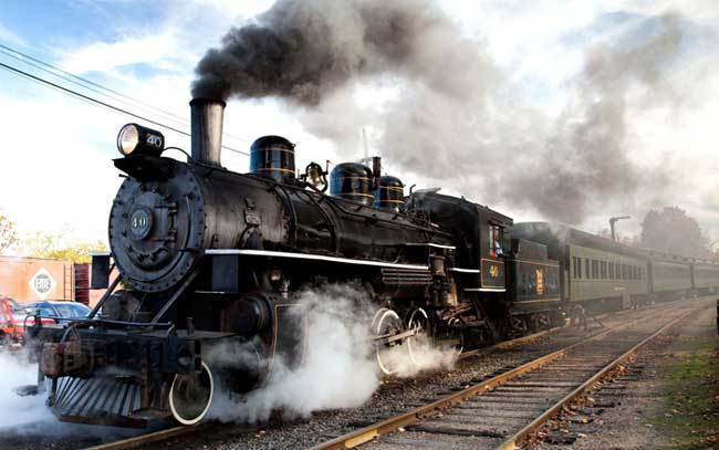 Steam engine coming down a track