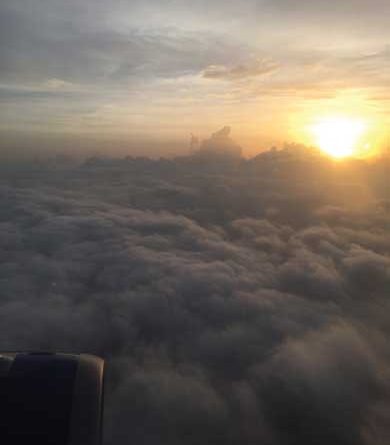 Sun peeking out above the clouds