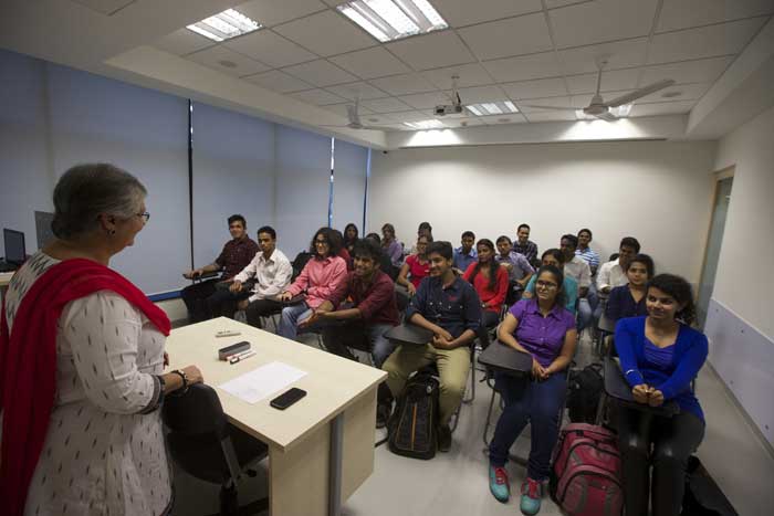 Professor talking to students at SPICE, Mumbai