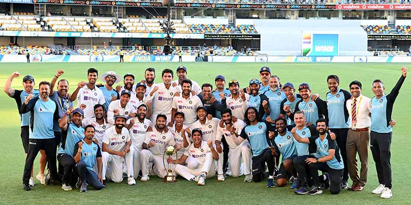 Team India poses with the winning trophy after defeating Australia by three wickets on the final day of the fourth cricket Test match at the Gabba, Brisbane, Australia on January 19, 2021