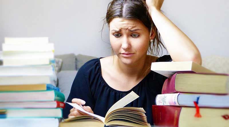 Female student feeling stressed out while studying
