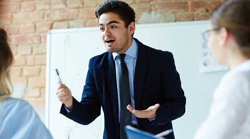 Young man speaking at a presentation