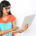 Young female student working on a laptop