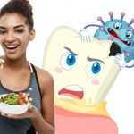 Young woman in workout clothes eating healthy food while a cartoon tooth with blue bacteria looms over her shoulder.