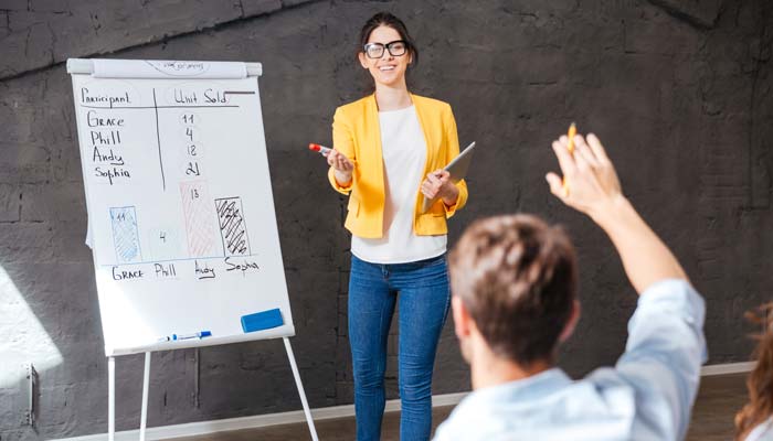 Young woman making a presentation to an audience