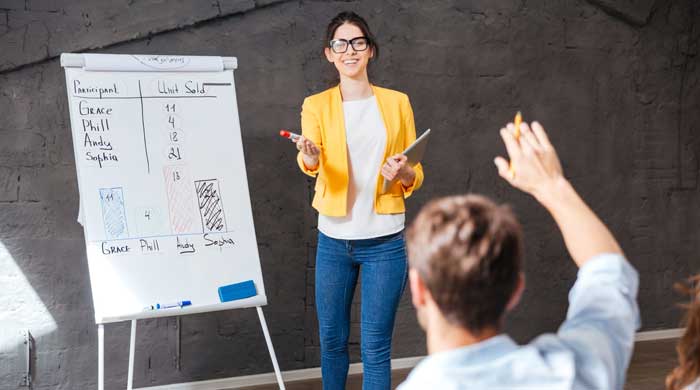 Young woman making a presentation to an audience
