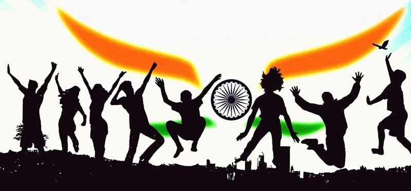 Silhouette of youth jumping in front of Indian flag colours