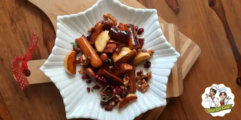 White plate with Apple and Sausage Salad on it.