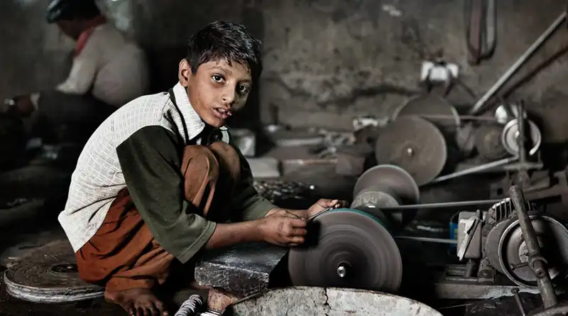 Boy working in a factory
