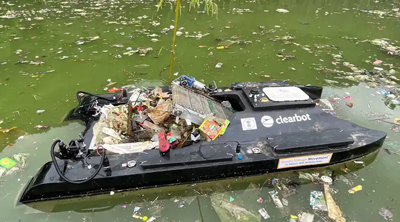 Clearbot robot boat collecting plastic waste from river