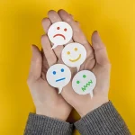 Top view of different feelings and emotions on two hands