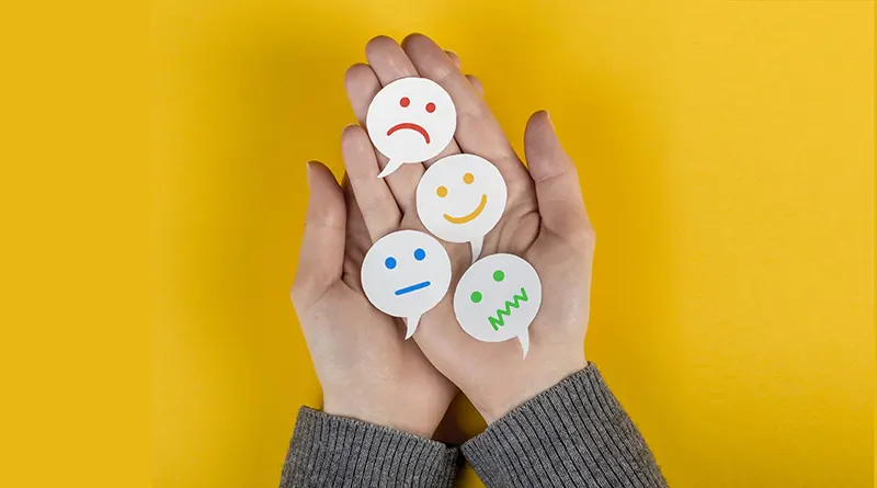 Top view of different feelings and emotions on two hands