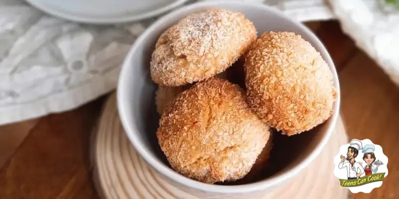 Eggless Coconut Macaroons in a bowl on a table.