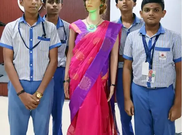 Iris, a humanoid robot teacher, standing with students of KTCT Higher Secondary School in Thiruvananthapuram, Kerala