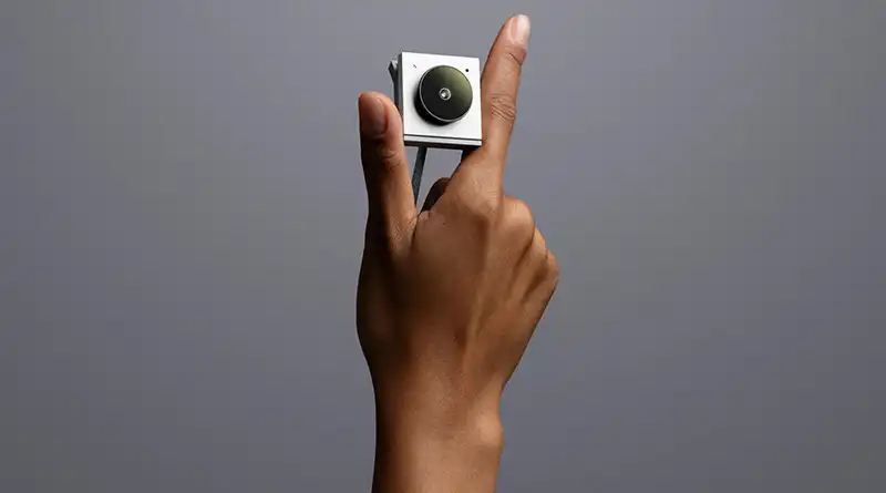 Hand holding the Opal Tadpole webcam