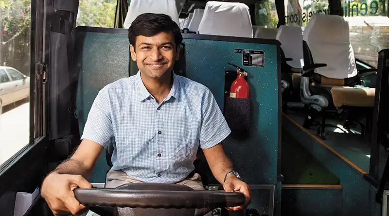 Phanindra Sama of redBus behind the wheel of a bus