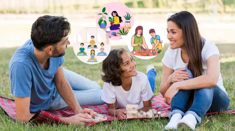 Happy young boy with his parents enjoying a picnic in a park