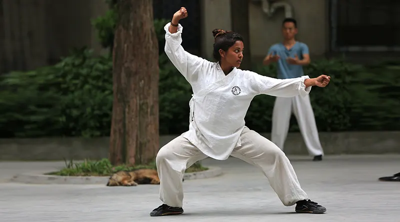 Young girl practising Tai Chi Chuan